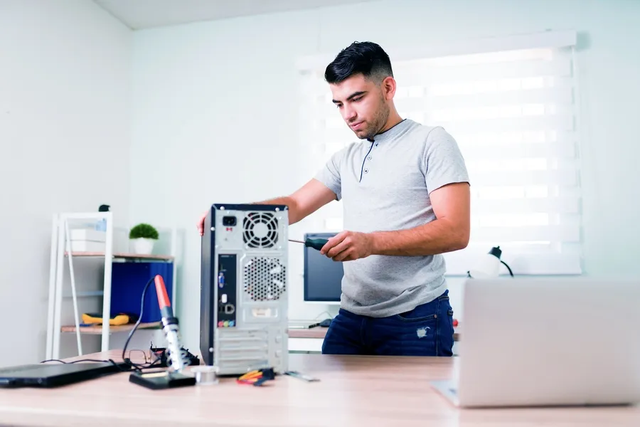 In Home Computer Support Technician Replacing A Desktop Computer's Power Supply In Montclair Home